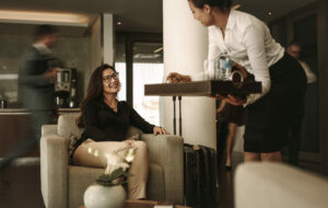 Business,Lounge,Staff,Serving,Coffee,To,Female,Traveler,At,Waiting